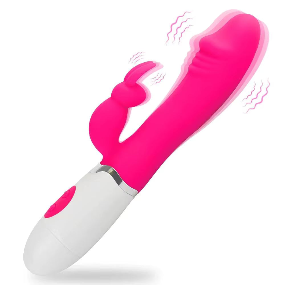 Pink and white electronic sex device on a white background. Rabbit Dildo